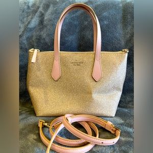 In very good condition pink glitter Kate Spade bag with long strap.